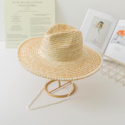China Large Brim Pearl Trim Straw Hat Sunshade Sun Protection Holiday Hat for women en venta